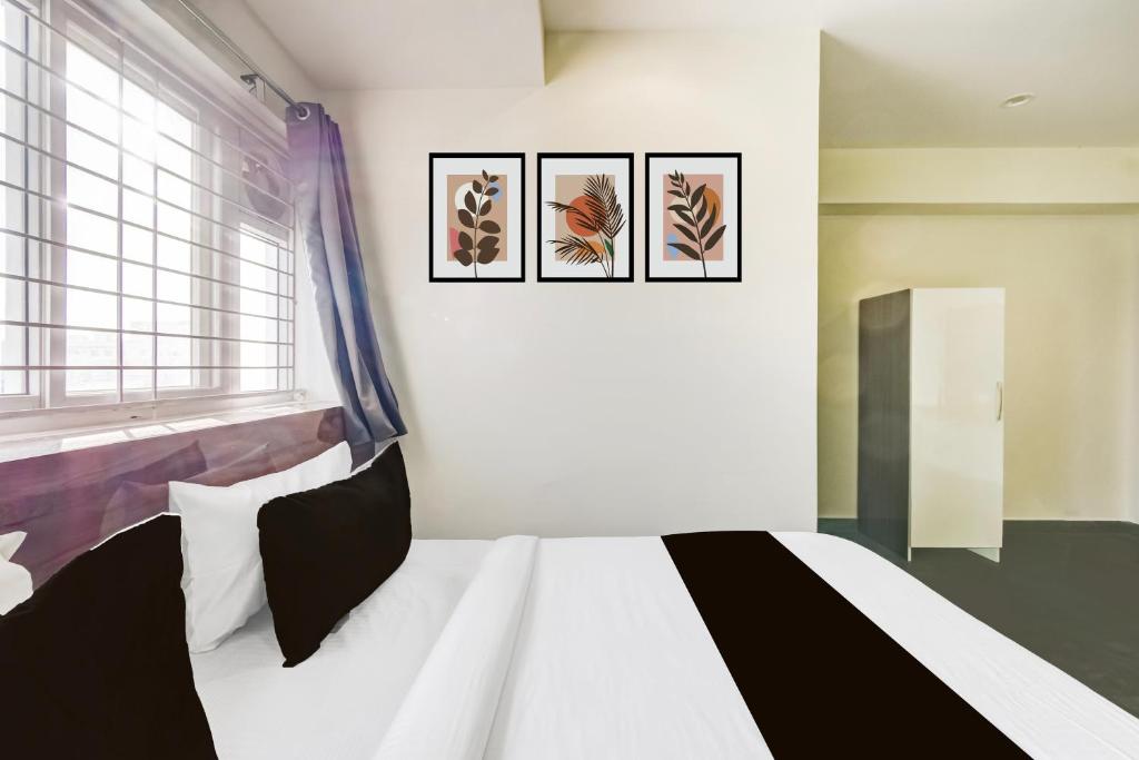 Ένα ή περισσότερα κρεβάτια σε δωμάτιο στο Hotel O Malani Inn