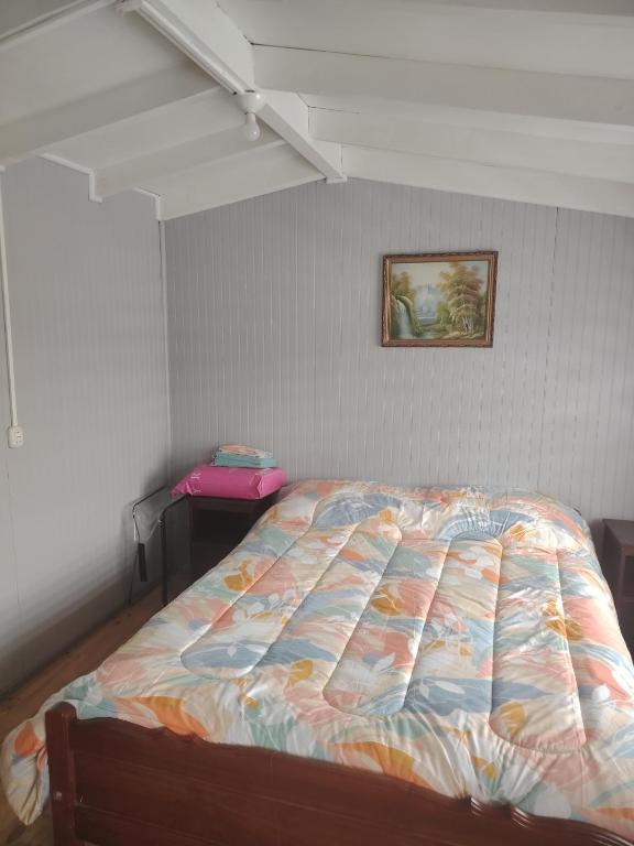 En eller flere senge i et værelse på Departamento