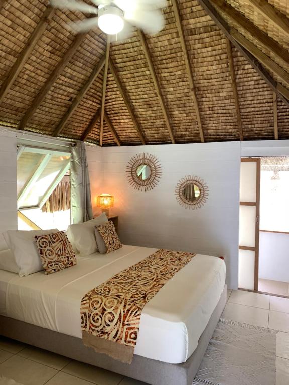 Postel nebo postele na pokoji v ubytování FARE TEMANEA