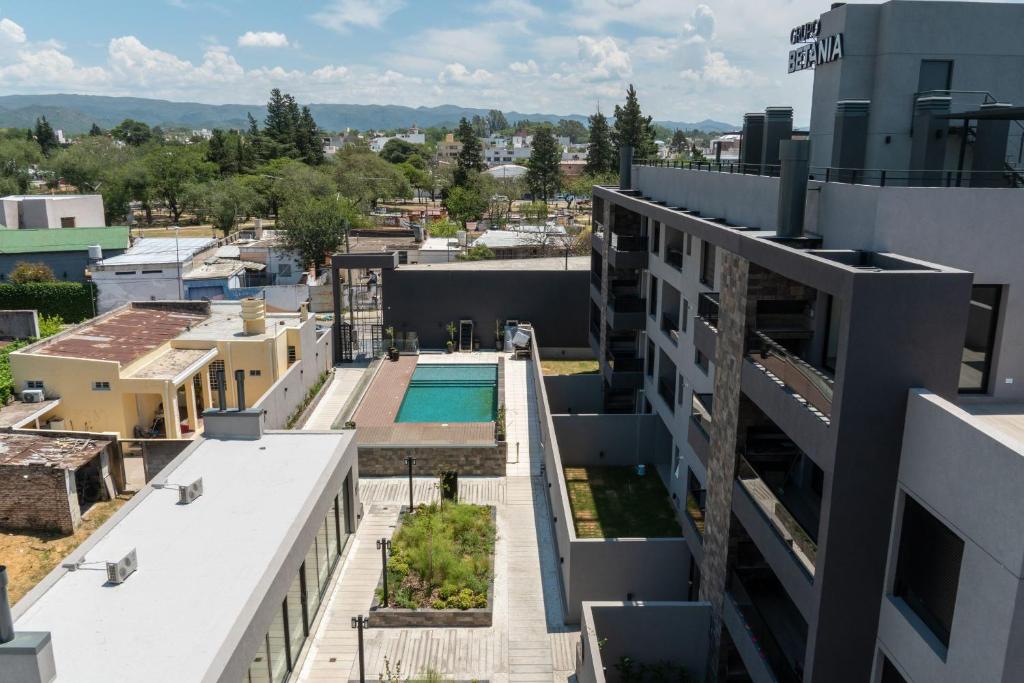 an aerial view of a building with a swimming pool at Las Pircas PB in Alta Gracia