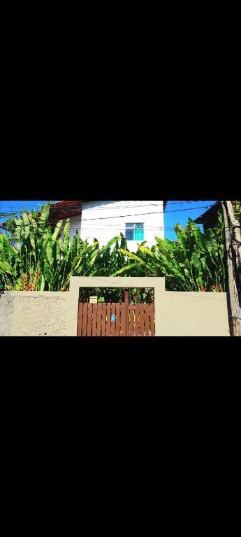 a view of a building with plants in the background at BOIPEBA Cantinho do Mirko 3 in Ilha de Boipeba