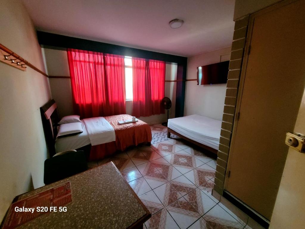 Postel nebo postele na pokoji v ubytování Las Estrellas Hostal