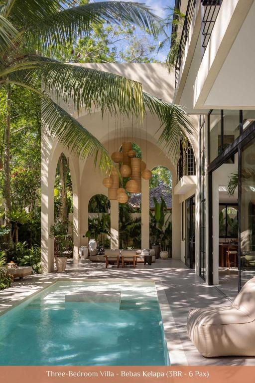a swimming pool in the middle of a house at Bebas Villas - Uluwatu, Bali in Uluwatu