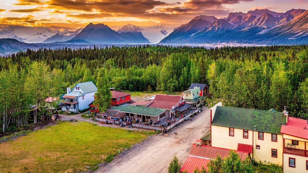 an aerial view of a resort with mountains in the background at McCarthy Lodge Resort in McCarthy