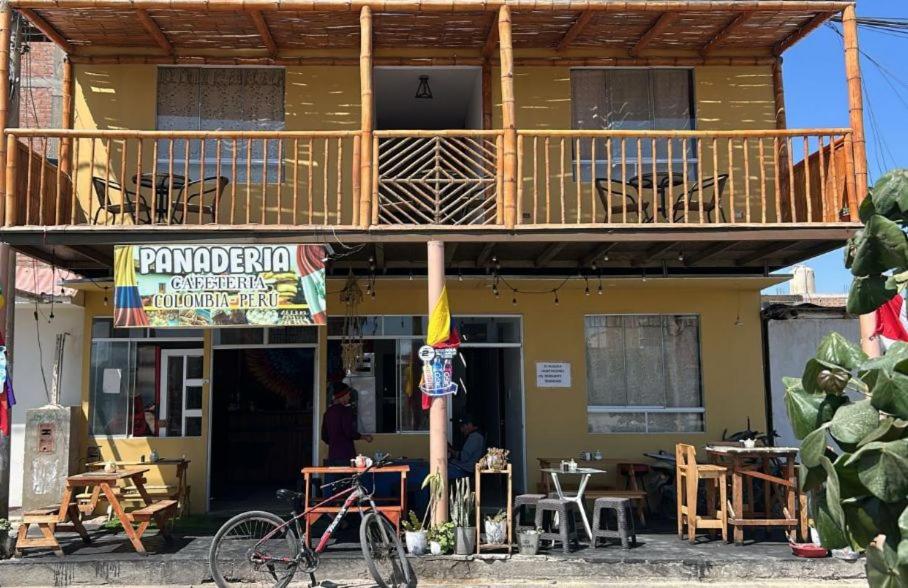 a building with a balcony on top of it at Flamante atardecer in San Antonio