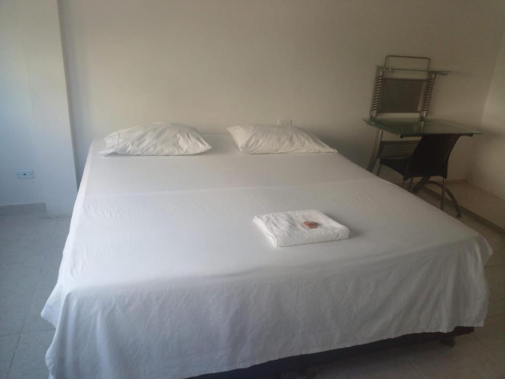 Giường trong phòng chung tại Hotel Plazuela Real