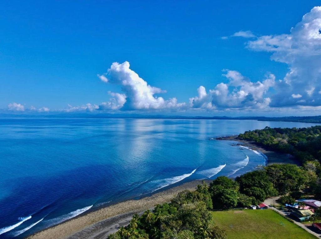 an aerial view of a beach and the ocean at Departamento Pavones Beach Retreat in Pavones