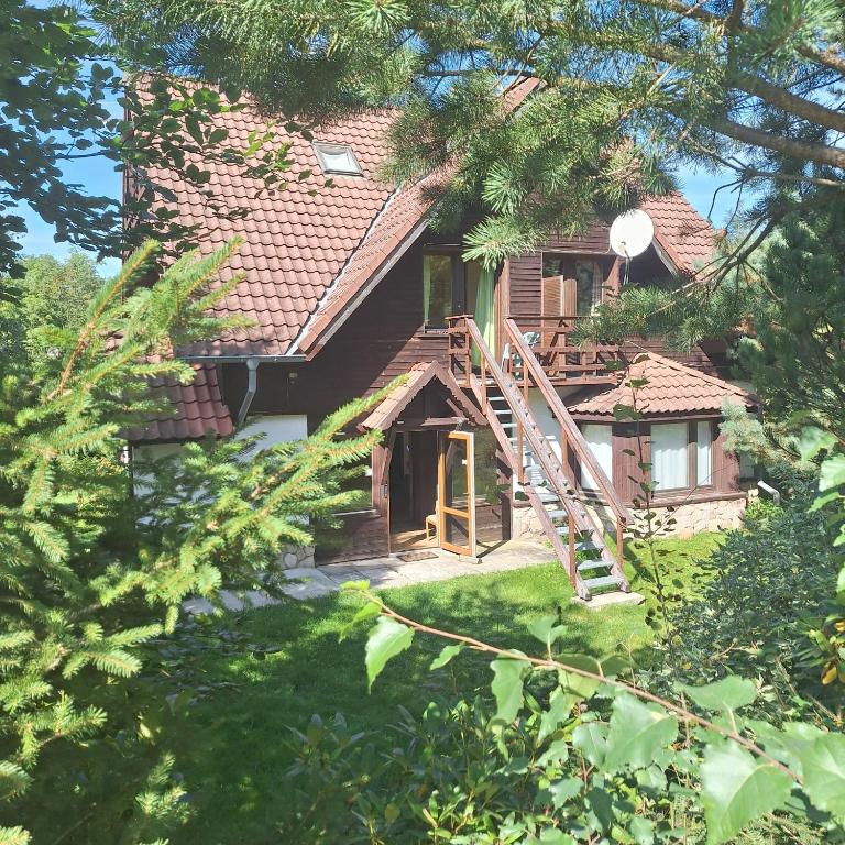 a house with a staircase leading up to it at Dom Karpacz -Wolna in Karpacz