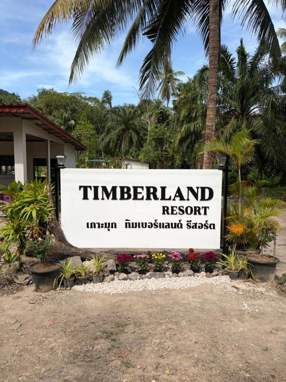 a sign for a resort in front of a building at Kohmook Timberland Resort from Seaview in Koh Mook