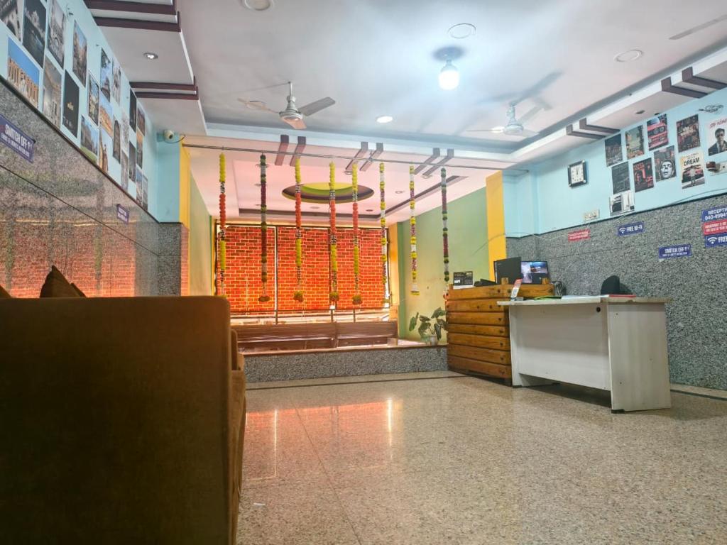 a waiting room with a counter and a large window at KEBA Dream Grand in Secunderabad