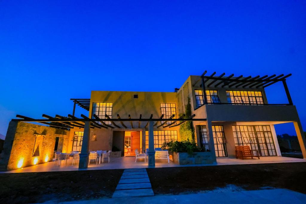a house at night with its lights on at Kokasemera Country Villa in Fort Portal