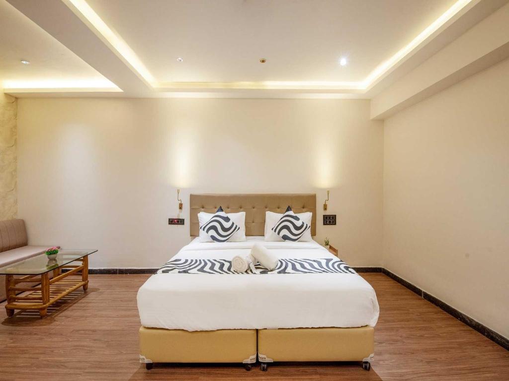 Giường trong phòng chung tại Palette Hotel by CheckIn Pune, MIDC Chinchwad