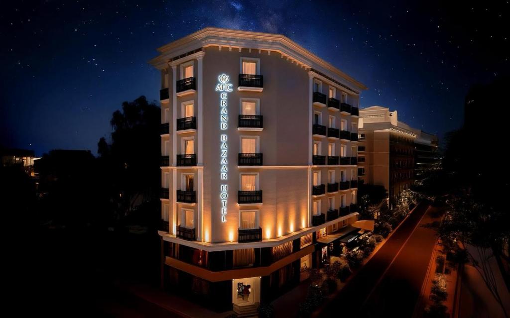 a building with a sign on it at night at AHC Grand Bazaar Hotel in Istanbul