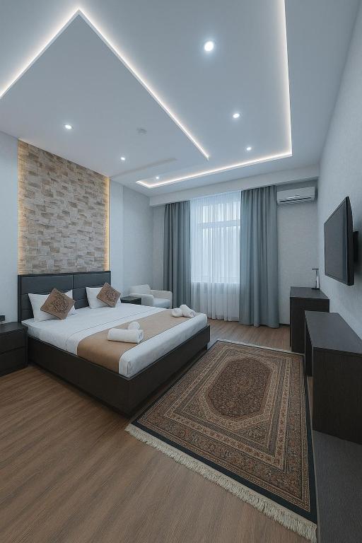 Ένα ή περισσότερα κρεβάτια σε δωμάτιο στο Vatan Hotel