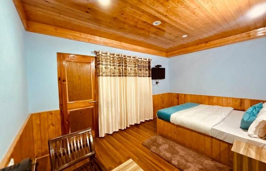 Postel nebo postele na pokoji v ubytování Hill Ice Guesthouse - Tosh Valley