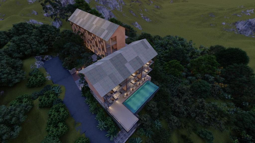 Te Dalu Resort & Spa في إيلا: اطلالة علوية على منزل به مسبح