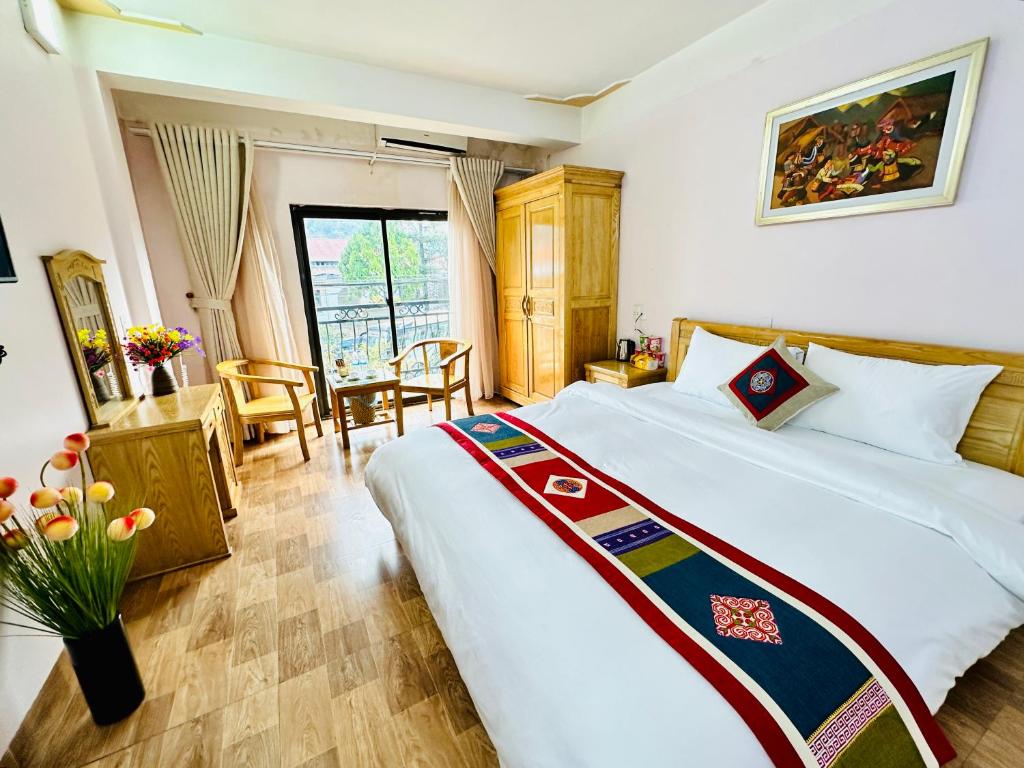 Postel nebo postele na pokoji v ubytování DH Sapa Hotel & Travel