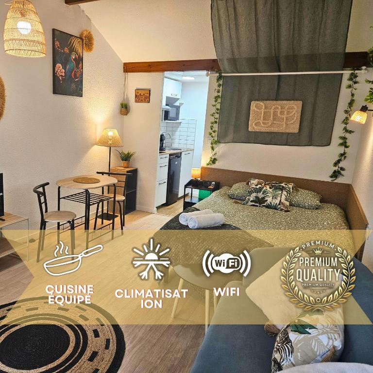 a bedroom with two beds and a dining room with a table at Fontaine - Centre - Wifi - Clim in Dax