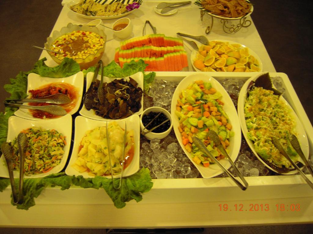 a table with many different types of food on it at Chiayi Look Hotel in Chiayi City