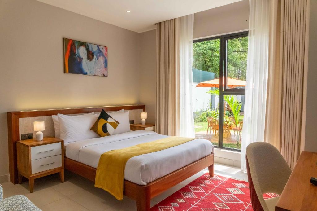 Postel nebo postele na pokoji v ubytování The Meru House