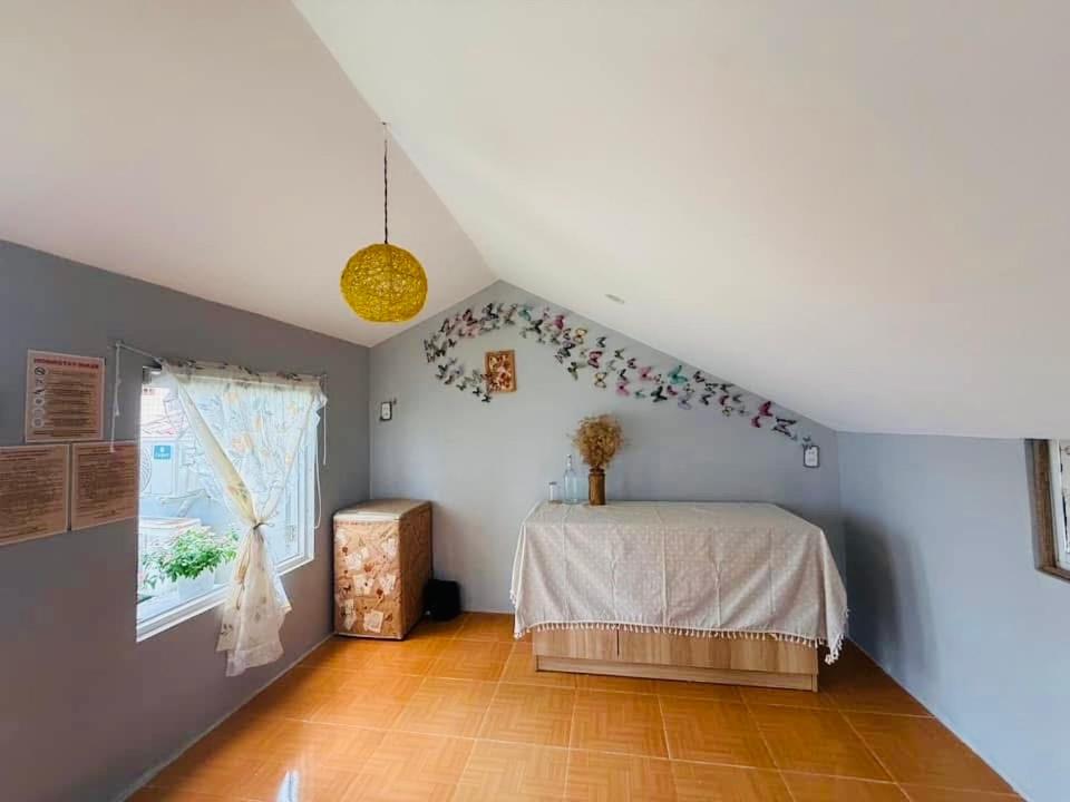 Postel nebo postele na pokoji v ubytování Hội An Spirit Homestay