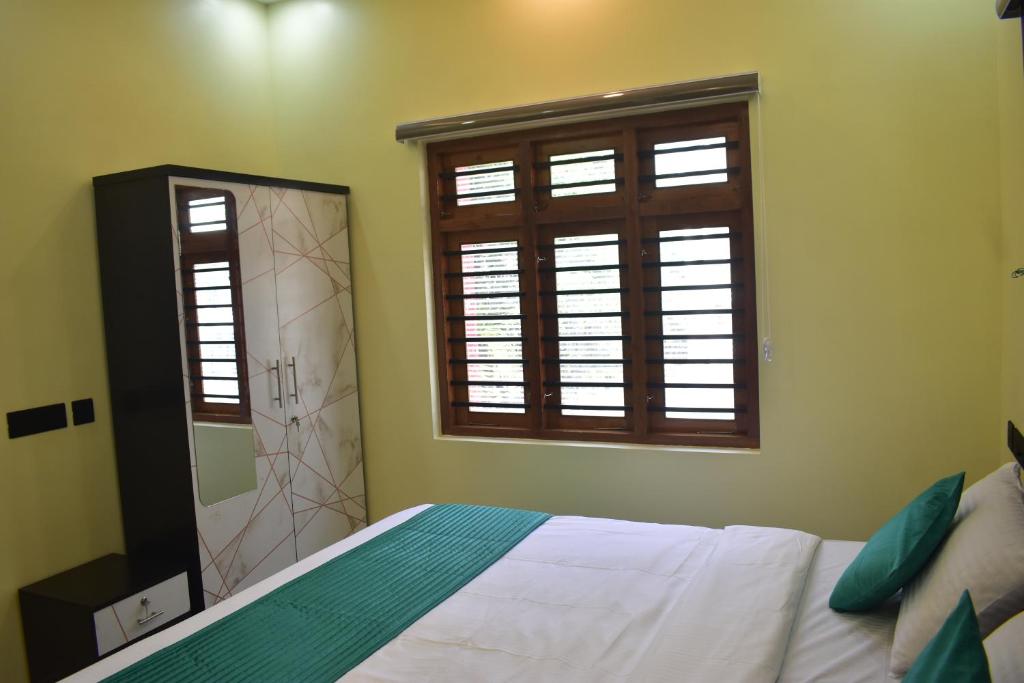 Un pat sau paturi într-o cameră la De Waves