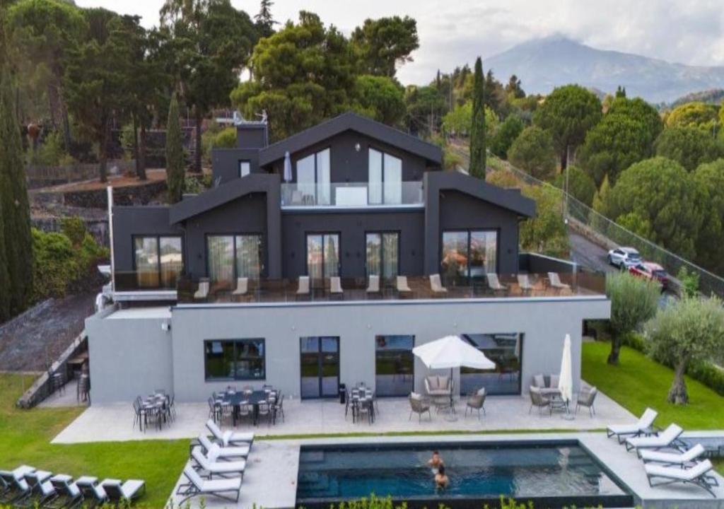 an aerial view of a house with a swimming pool at MòN Luxury Rooms SPA in Nicolosi