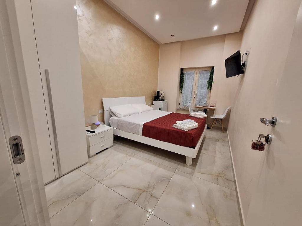 Postel nebo postele na pokoji v ubytování Pompei 79 AD b&b