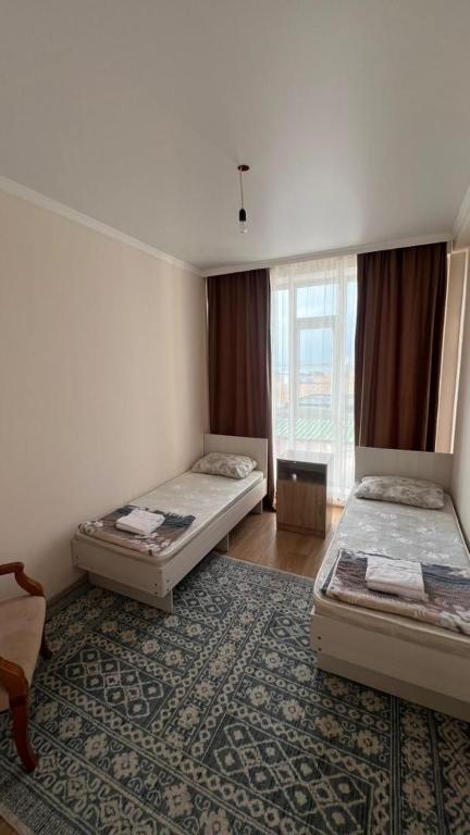 Una cama o camas en una habitación de Apartment Bosteri Beach