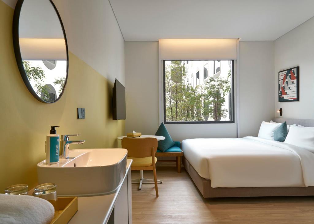 En eller flere senge i et værelse på GO Hotel Bangok Suvarnabhumi Airport