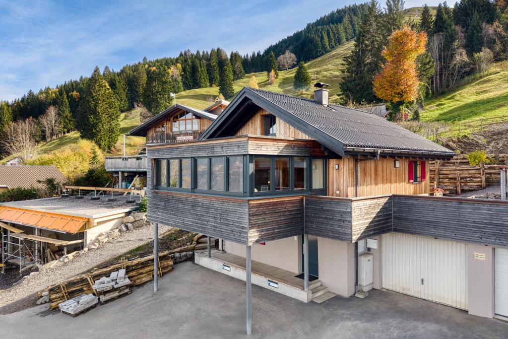 a house on top of a building on a lot at Panorama Ferienhaus Zora in Frastanz