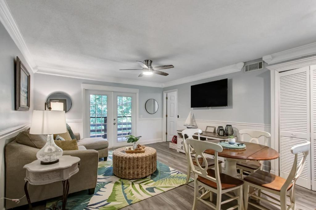 a living room with a couch and a table at Fernandina Beach Hidden Gem - Amelia Landings - 9F in Fernandina Beach