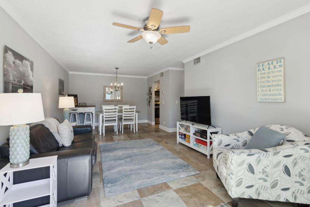 a living room with a couch and a ceiling fan at Tranquil Beach Retreat - Fernandina Shores 6398 in Fernandina Beach