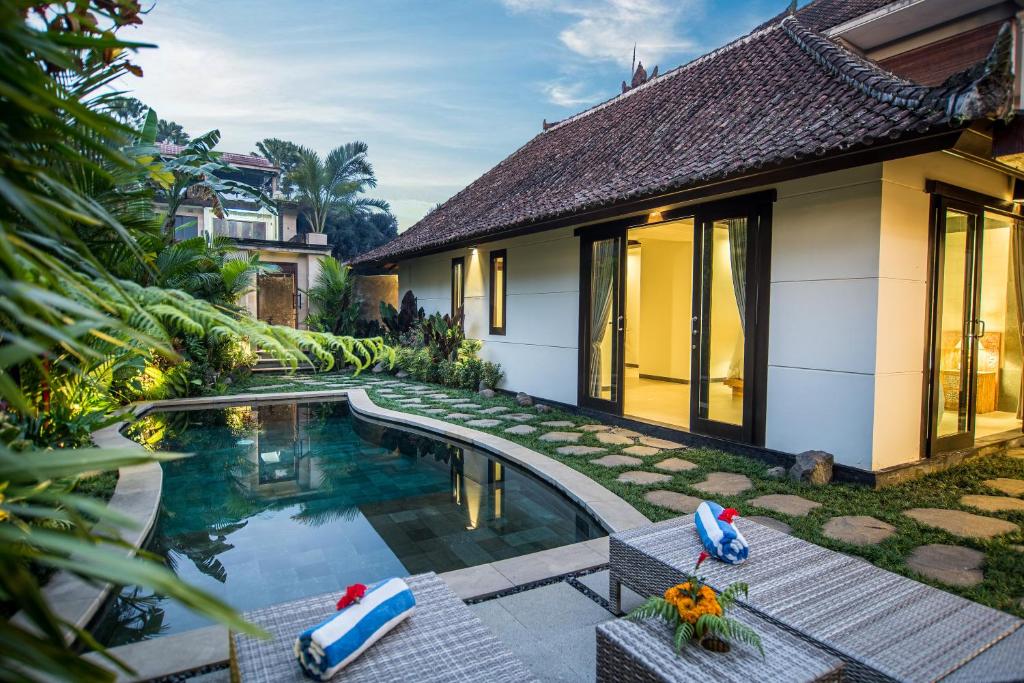 an image of a villa with a swimming pool at Wardana Ubud Villa I in Ubud