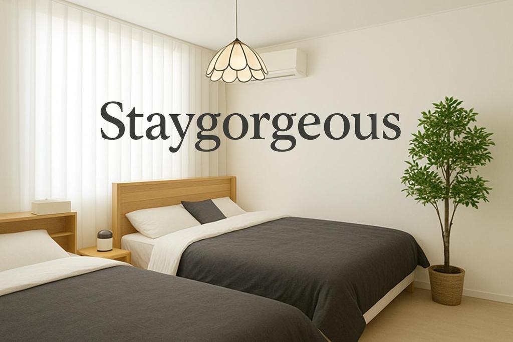 Postel nebo postele na pokoji v ubytování Ttukseom station Cozy Apartment 3R4QB8PPL SMenter Han river