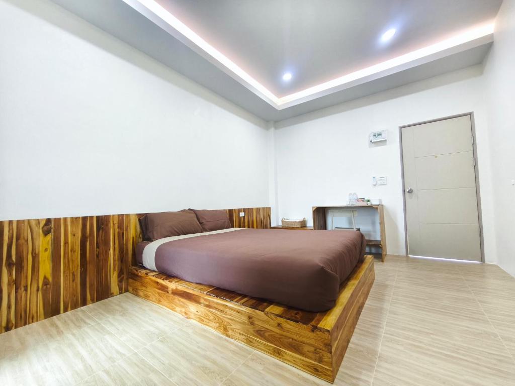 Postel nebo postele na pokoji v ubytování Nan Minimal ที่พักน่านมินิมอล