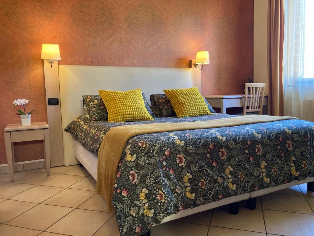 Giường trong phòng chung tại Villa Rosita