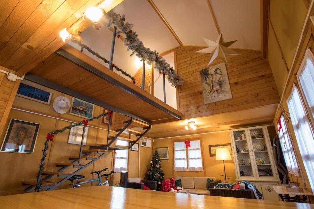 a living room with a spiral staircase in a house at Morning Star River Retreat in Belgrade