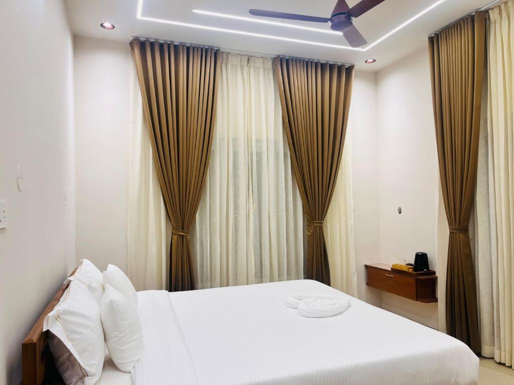 En eller flere senge i et værelse på ILA Beach residency