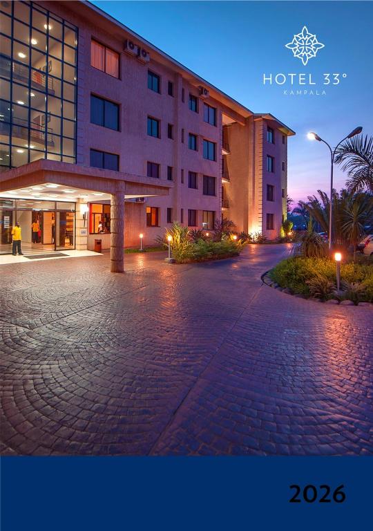 an empty parking lot in front of a hotel at Hotel 33 Kampala in Kampala