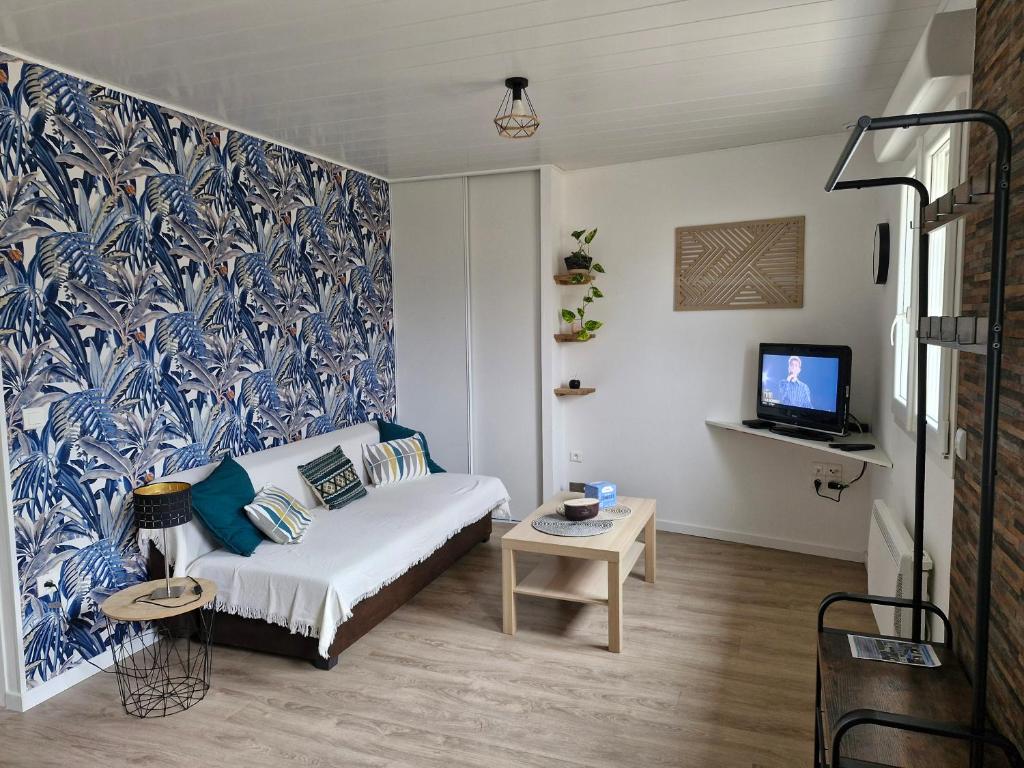 Ένα ή περισσότερα κρεβάτια σε δωμάτιο στο Hébergement 4 personnes au calme