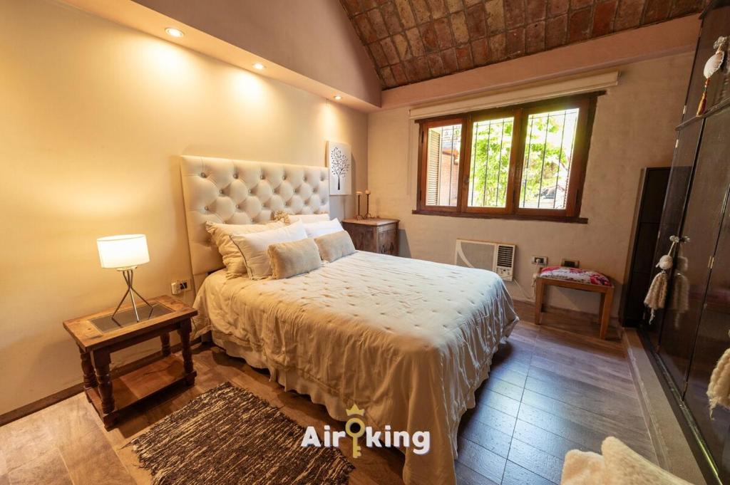 En eller flere senge i et værelse på Chill House Con Pileta