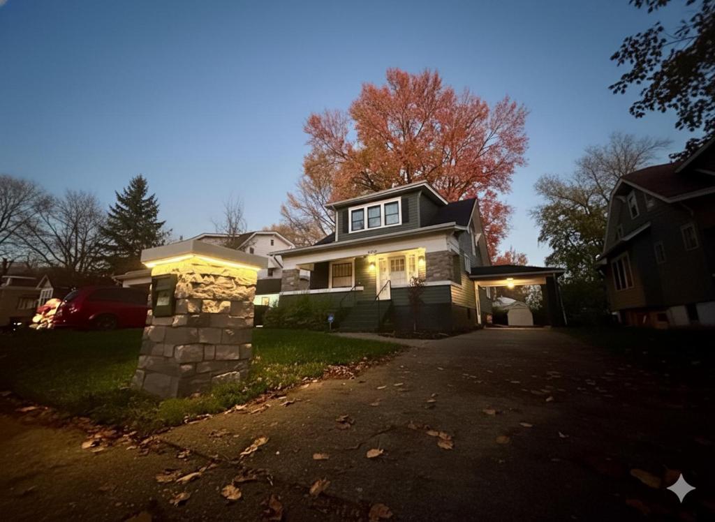 a house with its lights on in a driveway at Derby and Downtown in Louisville