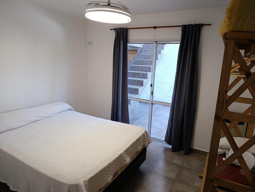 Ένα ή περισσότερα κρεβάτια σε δωμάτιο στο Departamentos Talamuchita