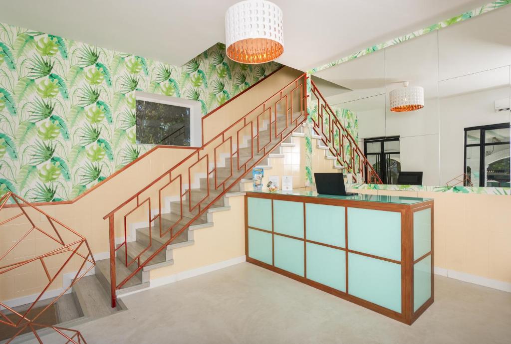 an office with a staircase with a desk and a stair case at Bluebelle Marbella in Marbella