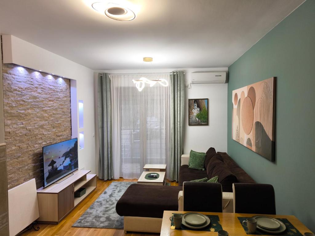 TV a/nebo společenská místnost v ubytování Alex apartman