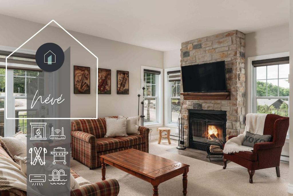 a living room with a fireplace and a tv at Neve Pool & beach in the heart of Mont-Blanc in Mont-Blanc