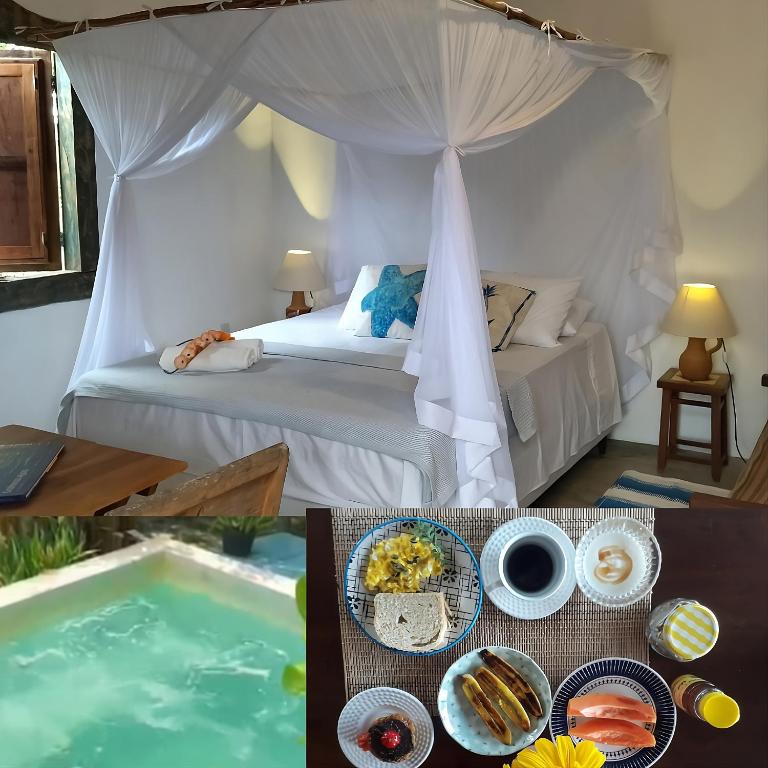 a room with a bed and a table with food on it at Pousada Céu de Corumbau in Corumbau