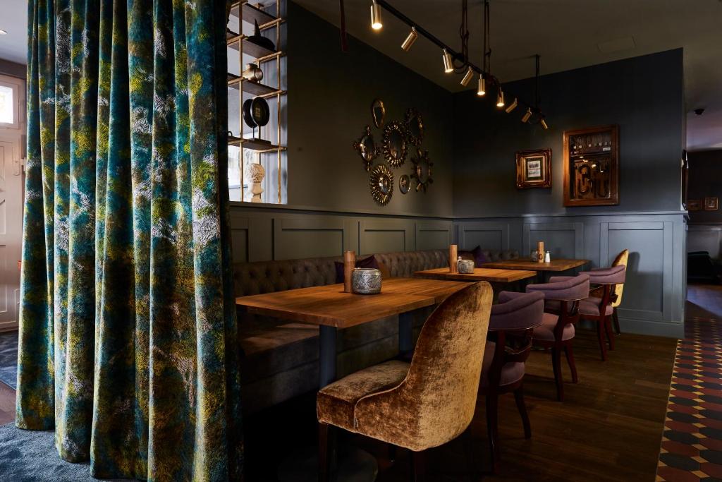 a dining room with wooden tables and chairs at Boutique Hotel Spedition a member of DESIGN HOTELS in Thun