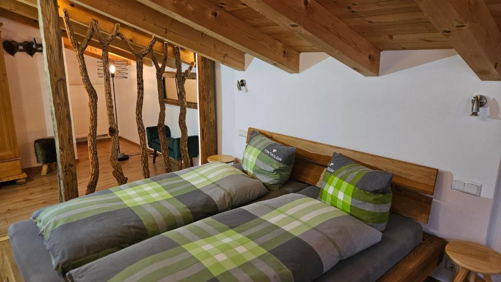 En eller flere senge i et værelse på Ferienhaus Ulla